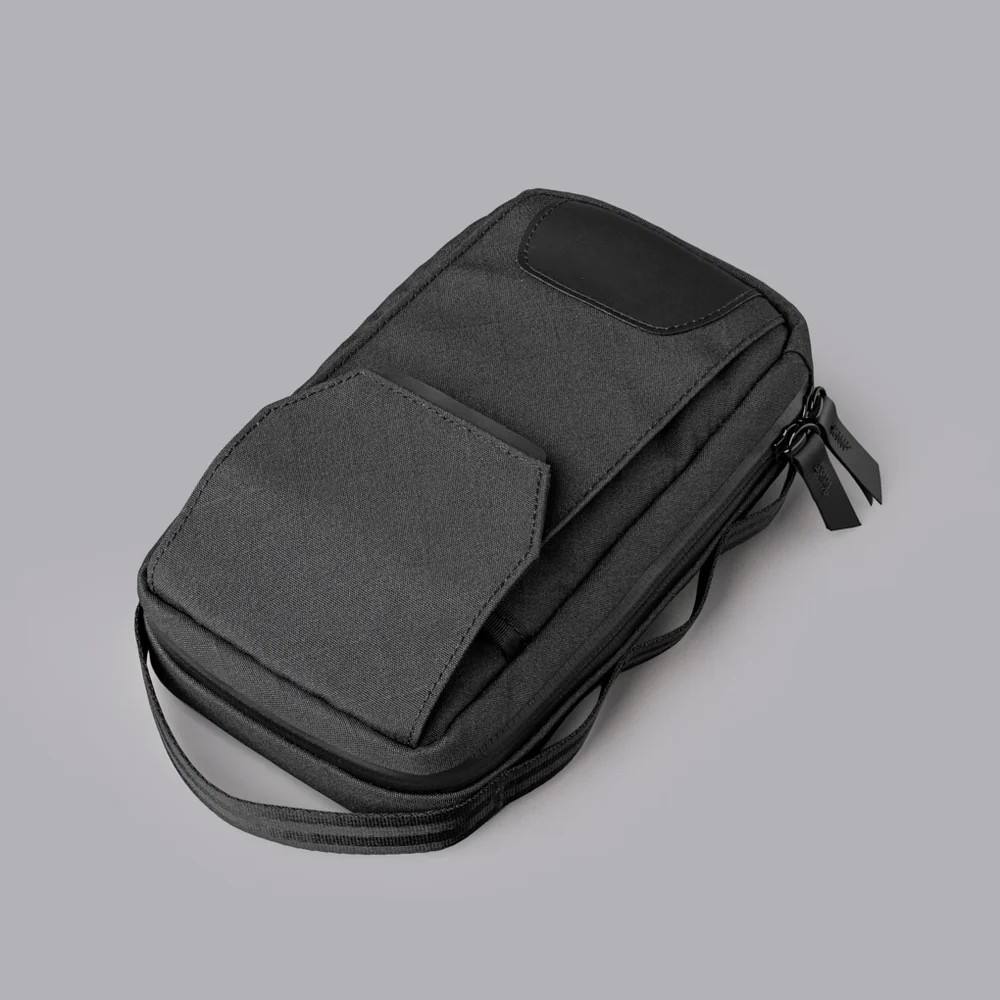 Compact Black Mini Phone Chest Bag with Leather Accent Adjustable Strap