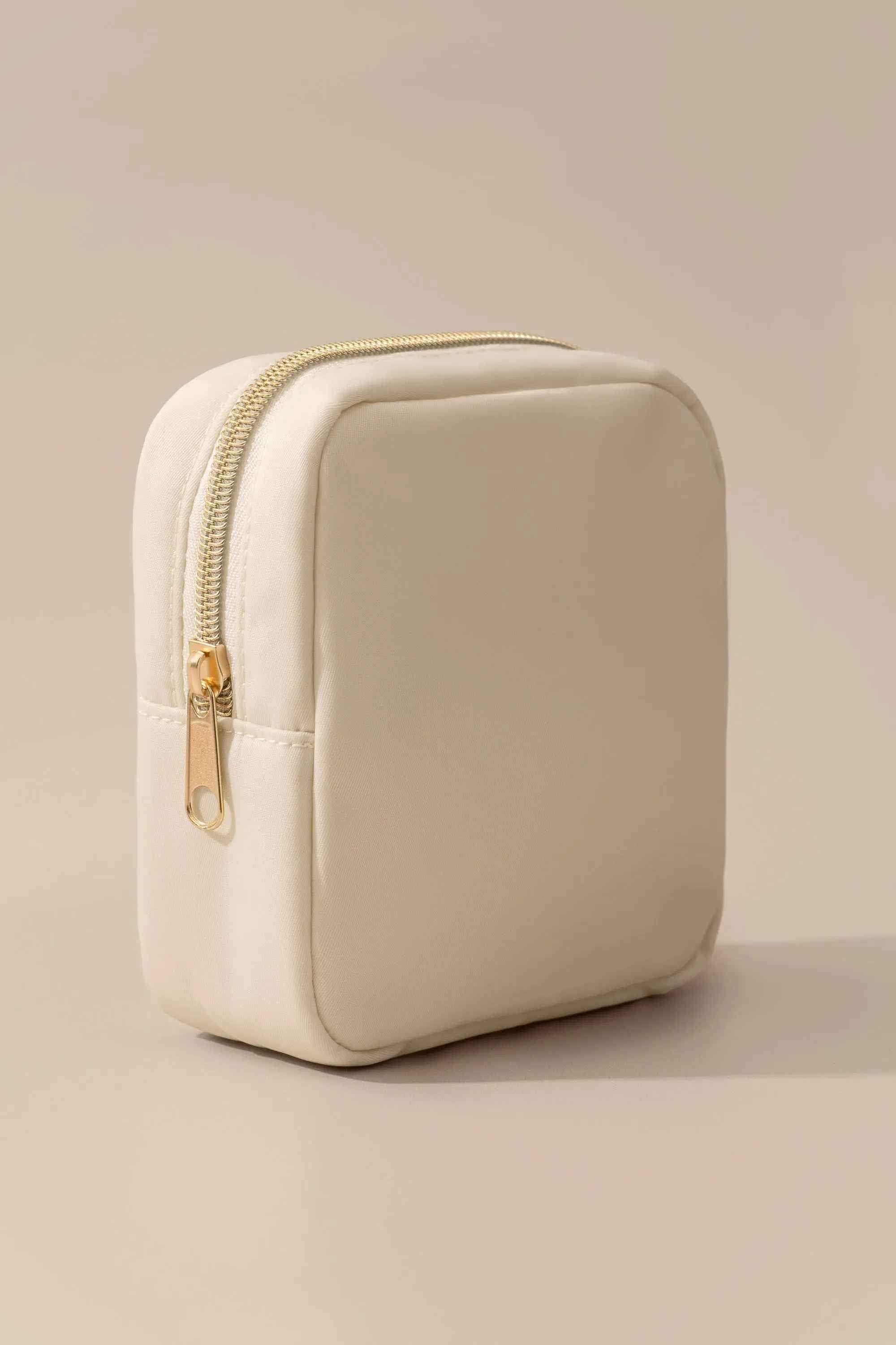 Soft Ivory Padded Clutch Bag with Polished Golden Metal Zip Fittings for Gentle Minimalist Daily Handheld Styling